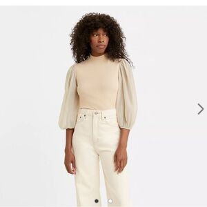 Levi’s snug mockneck with statement-making sleeves